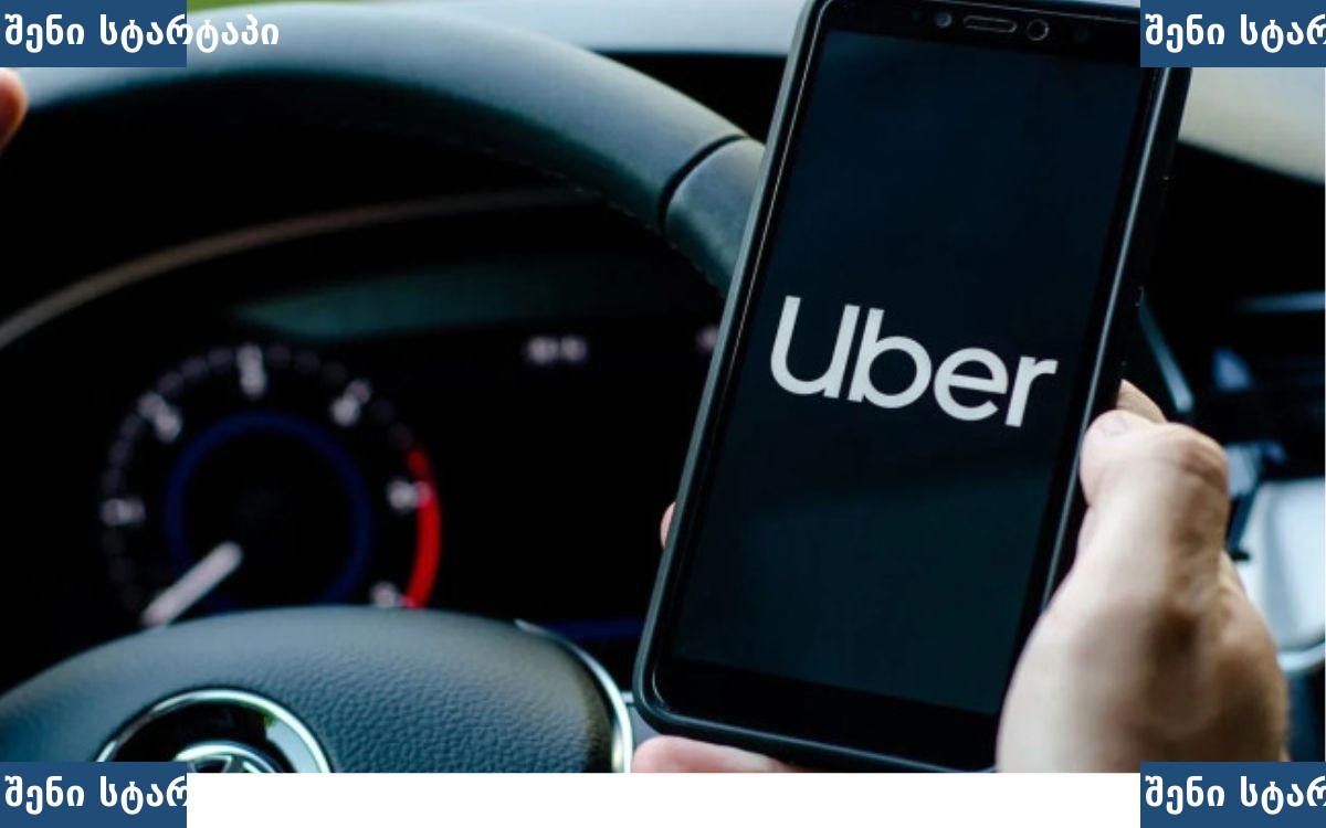 Uber-ის აპლიკაცია ტელეფონში, მანქანის საჭეზე — საქართველო